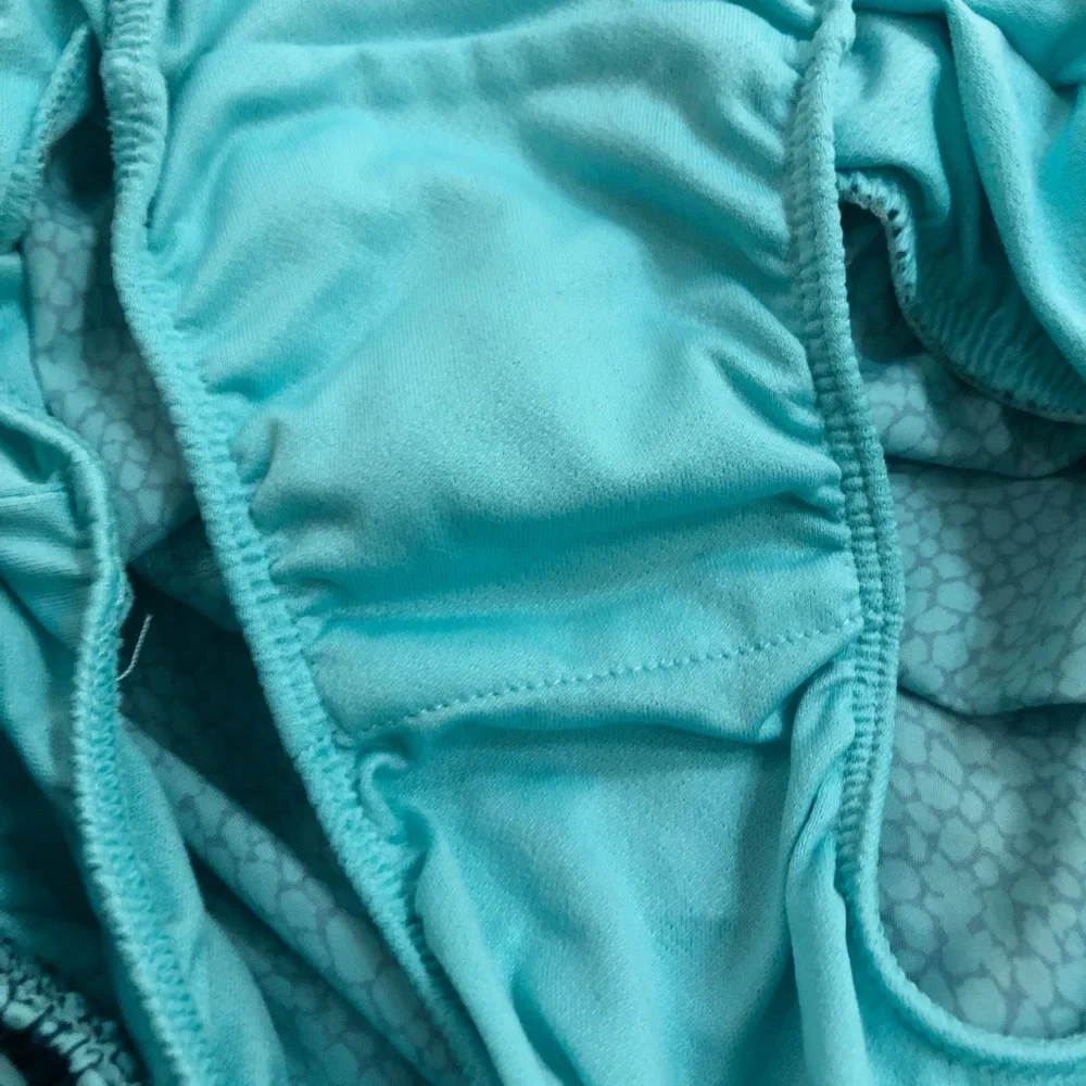 - Nike running shorts. Aqua and teal. Size Small